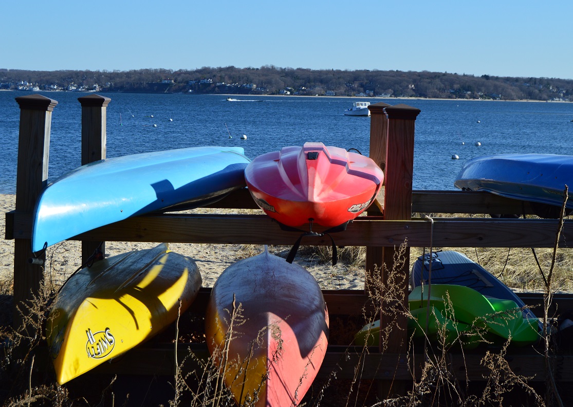 kayaks on a riverside rack